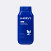 Blue bottle of Harry's 2-in-1 shampoo & conditioner on a light gray background